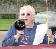 Janet Skibinski, president of the classified union, leads staffers in protest.