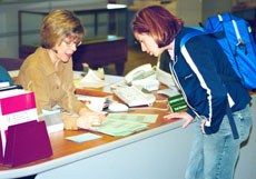 Librarian Marci Lingo helps liberal studies major Hannah Lamas with a question.