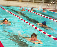 Manual Maldanado, left, and Nathan Hevle, both from Bakersfield High School, swin laps in the BC pool.