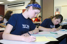 Ellen Dobie, left, and Leah Hazard of Bakersfield High compete in the editorial competition at BC during J-Day.