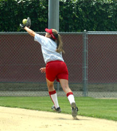 Shelli Jackson runs down an infield fly ball during practice.