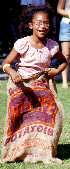 Nine-year-old Eliana Robinson shows determination during the potato sack race.