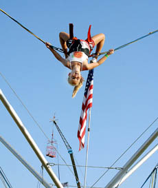 Madison Schnutzer, 9, fearlessly jumps and spins upside down at the fair.