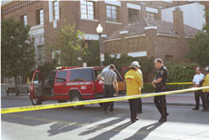 Firefighters and hazardous waste officials cordon off Eye Street in front of The Californian on Tuesday.