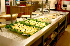 A smorgasboard of international cuisine is prepared and served to guests by the students who cook them.