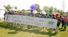 Cancer survivors display banner during annual Relay For Life at CSUB Saturday.