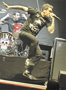 Jordan Pundik, lead singer of Newfound Glory, rocks out before Green Day at a Centennial Garden concert on Nov. 20.
