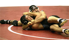 BC wrestler Andrew Guzman, top, takes control of match against Moorpark´s Walter Mendez. Guzman won the match 17-0.
