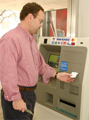 n Turney, dean of students,  was the first person to use the new ATM