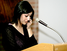 Nicole Chavez, granddaughter of the late Cesar Chavez, wipes away tears as she speaks about her grandfather.