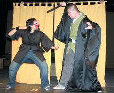 Monica Meza, left, a Shinobie who embodies a deamon, rehearses a fight with the medium character, played by Bryce Skidmore.