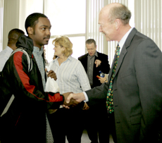 Destin Cook, a 19-year-old political science major, shakes hands with BC´s new president William Andrews.