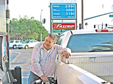 Antonio Cruz pumps gas at Fastrip next to BC.