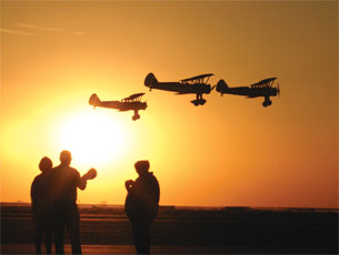 Spectators watch as planes fly by at Shafter Airport before the showing of North by Northwest. The show was part of a tour that plays classic movies at the original places they were filmed.