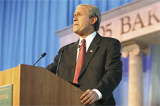 Bridges, a George W. Bush impersonator, talks to the crowd.