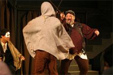 John Falstaff, played by Bob Kempt in the play Henry IV, turns coward when he is unexpectedly robbed.