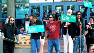 The band Korn, which is originally from Bakersfield, accepts street signs for the street renamed Korn Row during their rally in front of Rabobank Arena