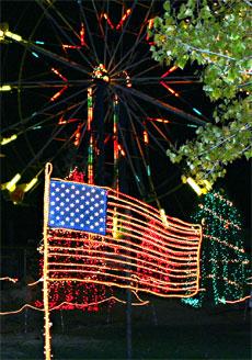 The American flag sits small beneath the Ferris wheel at CALMs event.