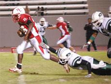 BCs Greg Williams avoid Tramond Winzor of East LA on Sept. 22 to score a touchdown in the second quarter.