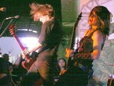 Shimon Moore, left, and Emma Anzai, right, of Sick Puppies during their performance at the Golden State Mall on Feb. 23.