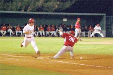 Bakersfield College second baseman Brandon Boren runs to first base at Ray Willis of LA Pierce College drops the ball in a gam March 8. Boren is hitting .374 with 35 RBIs.