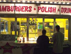 Two people wait for their food at the concession stand at the Kern County Fair.