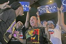 Michelle Johnson, center, cheers as CNN declares Barack Obama the winner of the presidential election at the Kern County Democratic party.