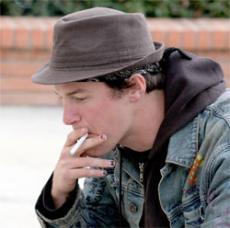 Andrew Thrash Collins, 23, smokes between classes.