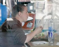 BC student Shandahn Champlain eats a salad with water in the Campus Center on March 30.