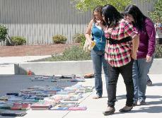 Students shop for used books in front of the Gil Bishop Sports Center on Aug. 24.