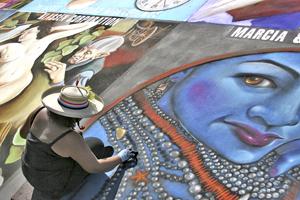 Marcia Rodriguez works on a piece at Via Arte in the Marketplace on Oct 10.