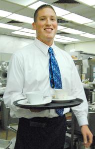 BC student Colby Tharp, culinary arts and business administration, exits the kitchen to serve patrons of The Renegade Room on Oct. 14. The Renegade Room is located on the Bakersfield College campus and is open for dinner Tuesdays and Thursdays from 5:30 -