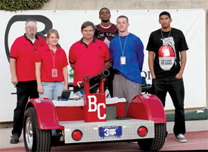 Cannon crew members (from left to right) John A. Medvigy, Tiana Ambrecht, Tim Chernabaeff, Derrick Johnson, Nick Crossan and Julian Sargent pose with the BC cannon Oct. 3.