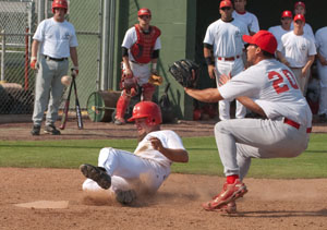 BC alumni and former Renegade baseball player Jason Pruitt slides into home plate for a stolen run during an alumni scrimmage Oct. 18.