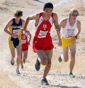Francisco Mejia runs up a hill at the Bakersfield invitation at Hart Park on Oct. 2. Mejia finished eighth overall and first for BC in the 4-mile race.