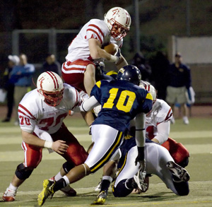 Bakersfield College running back Ben Estill takes his running game vertical against the College of the Canyons Cougar defense at Cougar Stadium on Nov. 14. Estill carried the ball 18 times for 80 yards and averaged 4.4 yards against Canyons.