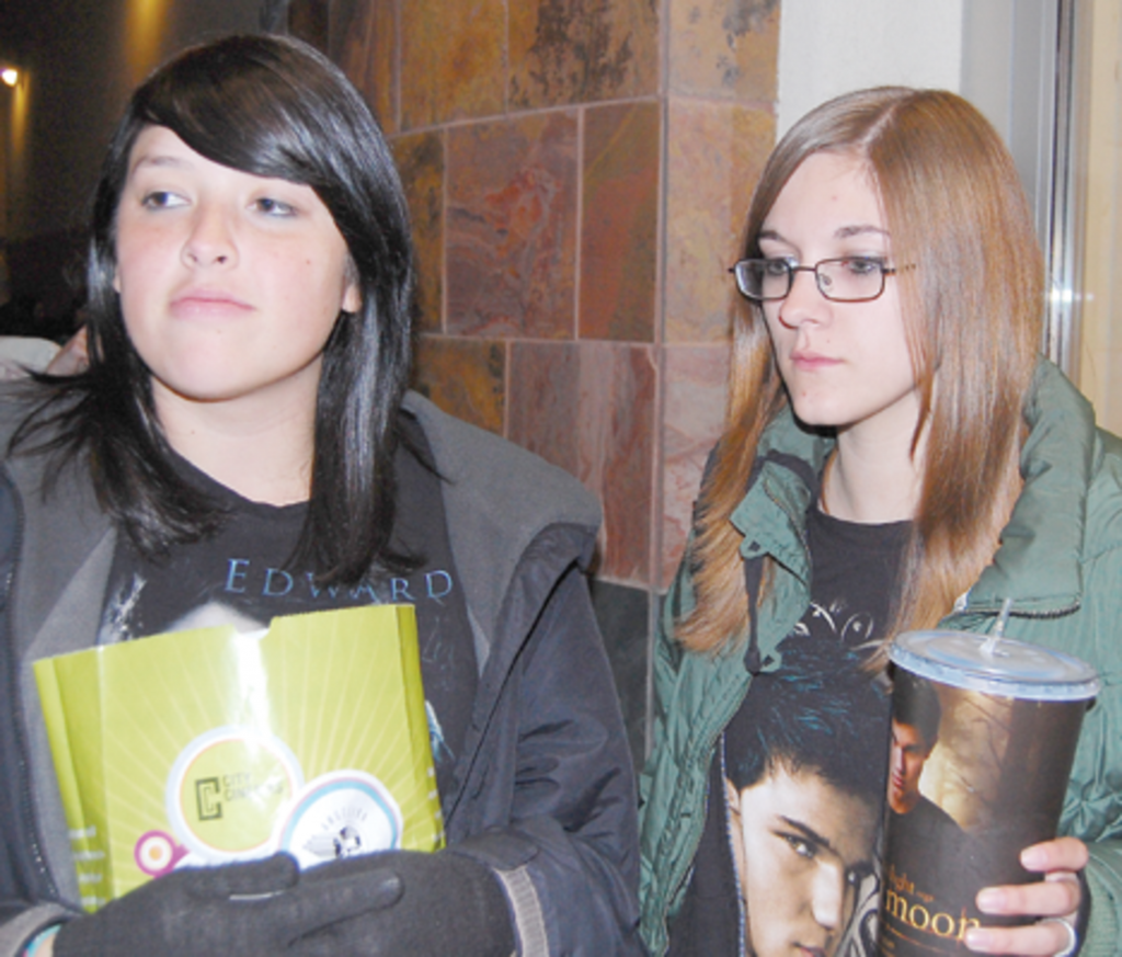 Jolynn Provencio, Team Edward, and Tara Rayes, Team Jacob, arrive at Reading Cinemas at 3 a.m. to be the first people in line for the midnight premier of New Moon Oct. 19.