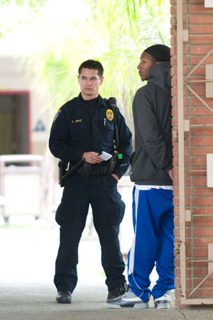 Bakersfield Police officers question a Bakersfield College student after he was arrested for brandishing a BB handgun and making threats in the Campus Center on March 9.