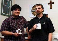 Barista David Balderas (left) and project leader Jeremy Hendricks pose with mugs in hand at Covenant Community Services on 29th Street on March 11.