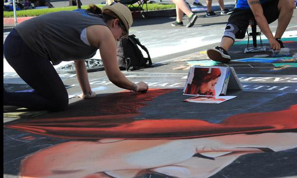 Robyb Dyer works on her ouece Refugee Mother and Her Child at Via Arte.