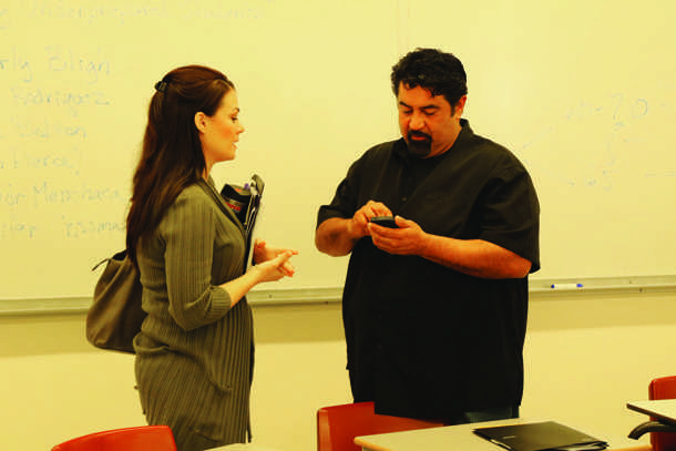 Bakersfield College returning students Junio Menchaca and Jennifer Crissman reflect on the panel presentation after the book discussion that too place Nov. 13 in a Business-building classroom.