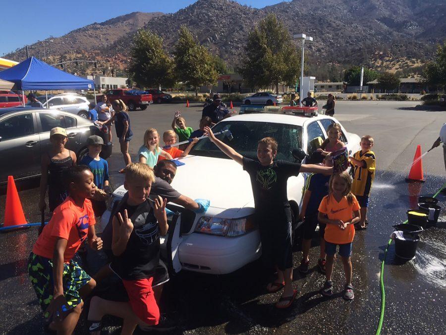 Alvarez stops by the Kern Valley Youth Football and Cheer car wash, to get his patrol car washed while donating to a good cause. 