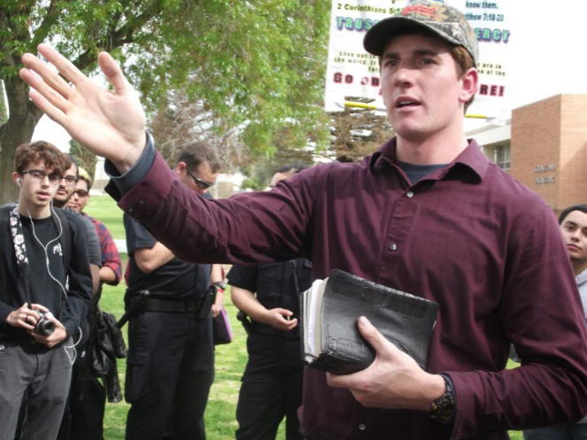 Nathaniel Runnels, preaching to a large crowd of engaging students. 