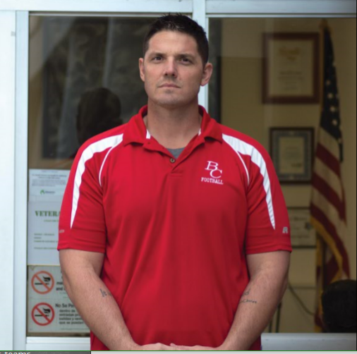 Jeremy Staat poses for a photo near the Veterans Center.