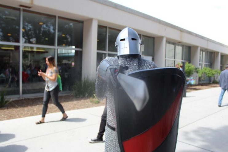 The+Bakersfield+College+knight+mascot+directs+people+waiting+in+line+for+free+ice+cream+to+step+back+by+pointing+a+sword+at+them+on+April+3+during+Spring+Fling.