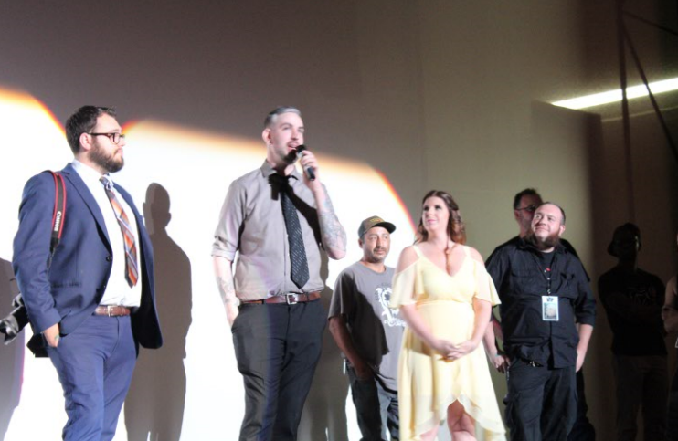 Brian Ross (middle) speaks about his experience working on the film “Border Brothers.”