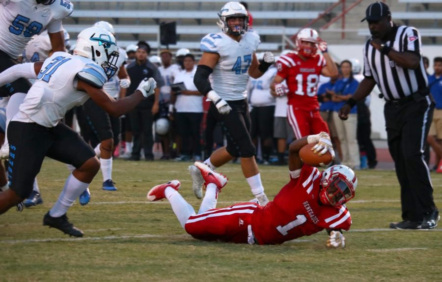 BC Renegade running back Elisha Ortiz breaking Moorpark’s defensive line as he inches
closer to scoring a touchdown.