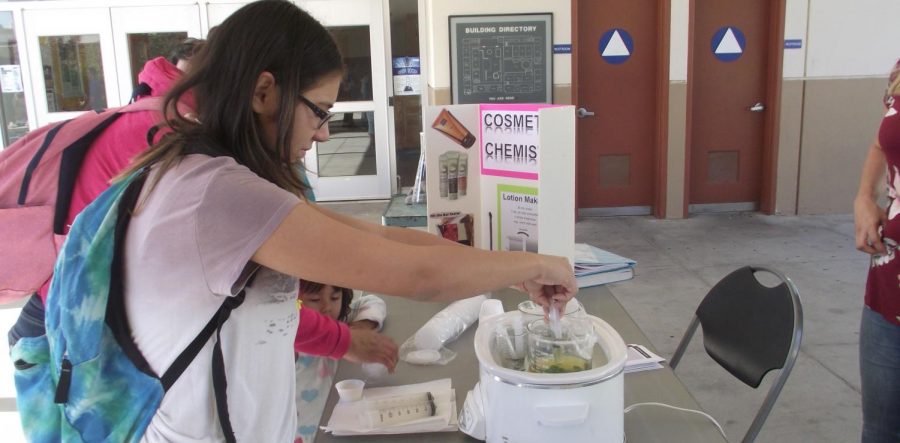 Emily Gibes, an animal science major going to Bakersfield College, measures out hot
oil and emulsifier to mix with water and lemon fragrance to create her own lotion.