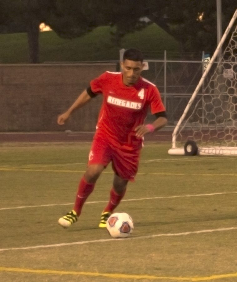 Maynor Alcaraz dribbles the ball back towards the opposing goal after a missed shot by Victor valley.