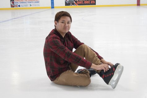 Christopher Cocay smiles at the camera as he ties his shoelaces tighter after taking a fall when his rented ice skating shoes loosened while ice skating on the local ice rink at the Bakersfield Ice Sports Center on Oct. 23.